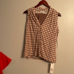 Cropped tan pants and sleeveless top